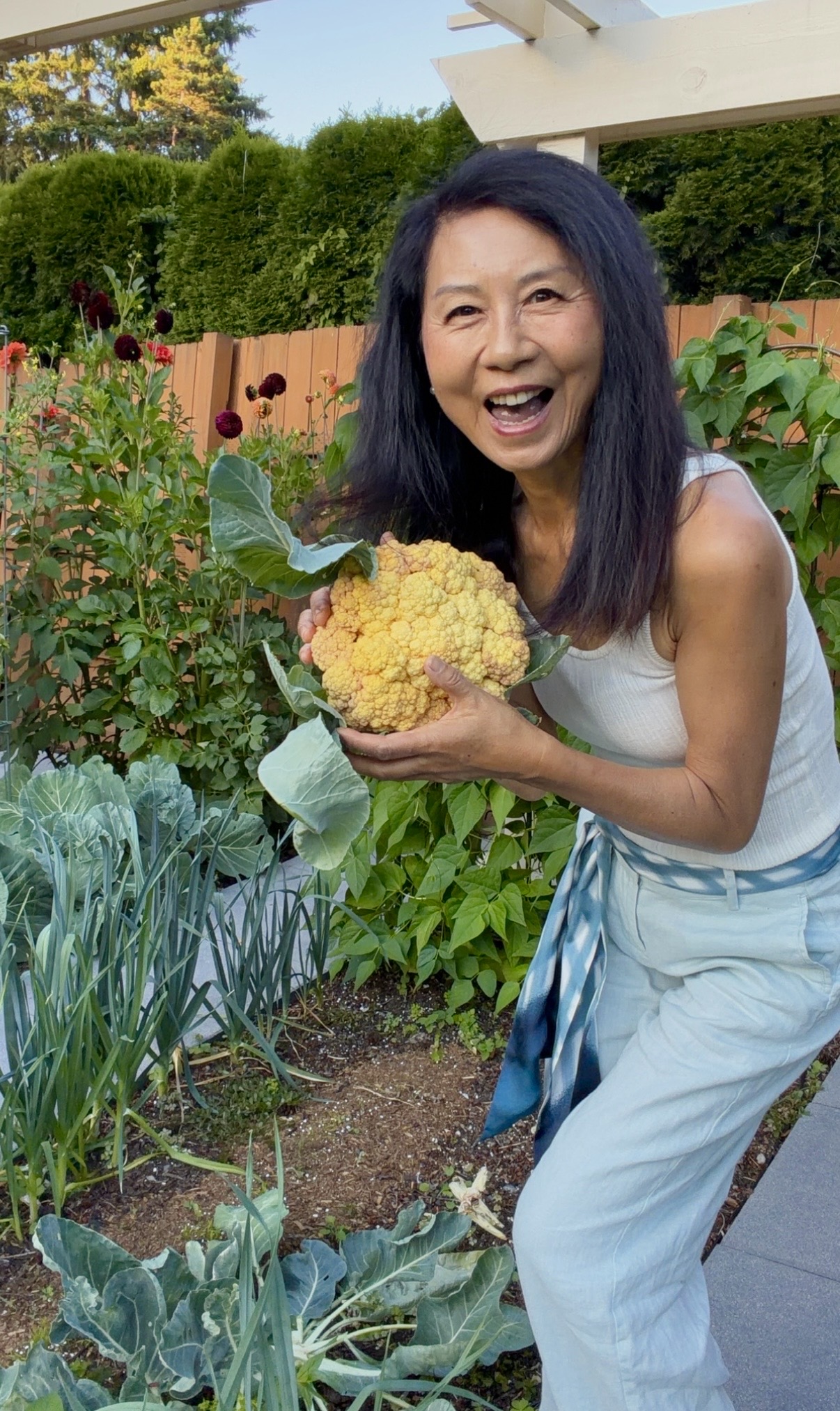 Janney laughing with a yellow cauliflower